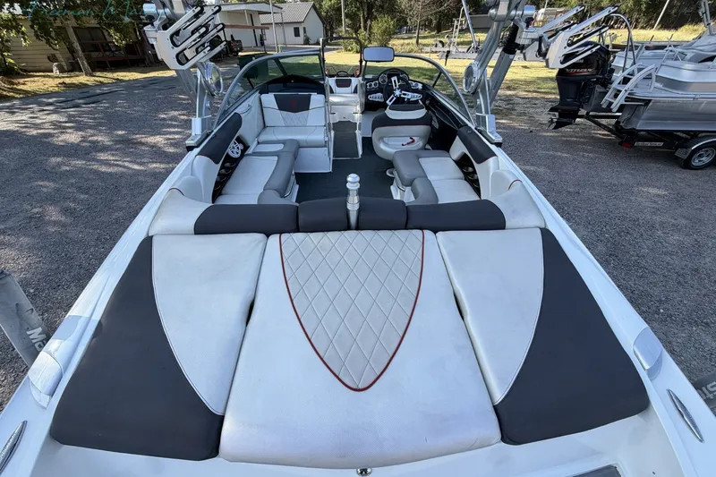Slide: The Image of 2011 MasterCraft X-35 boat interior with spacious seating and sleek design. - 11