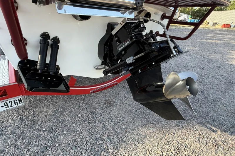 Slide: The Image of Rear view of a 2006 Profile 260 V boat with MerCruiser outdrive. - 32