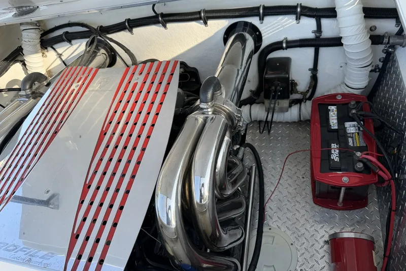 Slide: The Image of Engine compartment of a 2006 Profile 260 V boat with battery and exhaust system. - 10