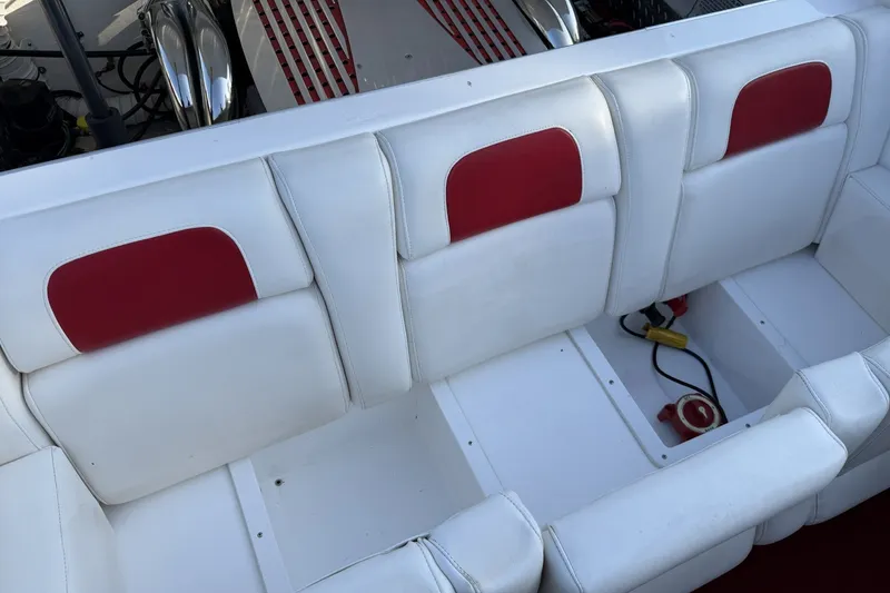 Slide: The Image of White and red boat seating in a 2006 Profile 260 V model. - 12
