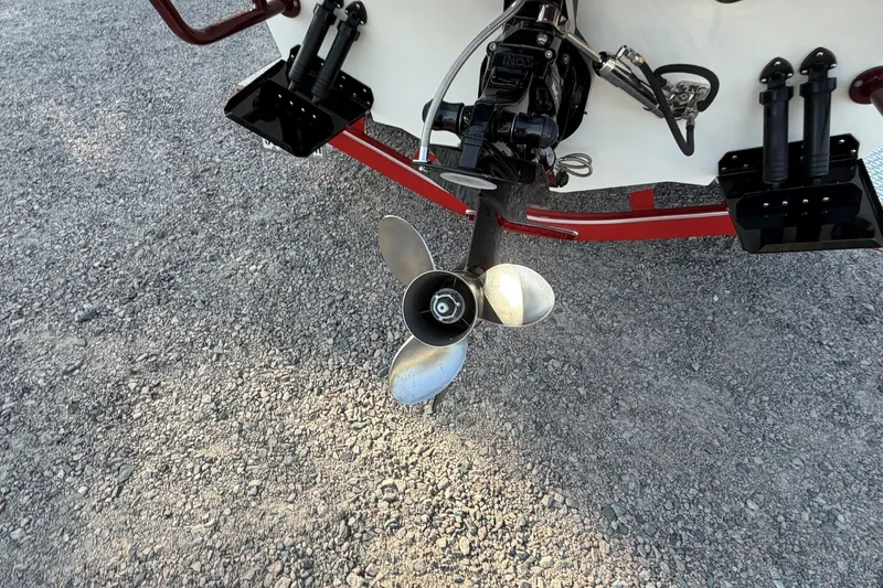 Slide: The Image of Boat propeller and motor assembly on gravel, Profile 260 V, 2006 model. - 31
