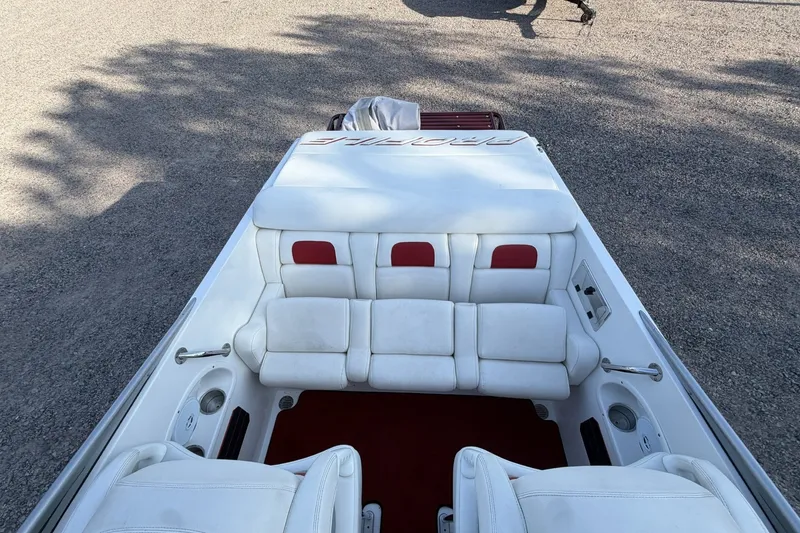 Slide: The Image of Interior of a 2006 Profile 260 V boat with white and red seating. - 23