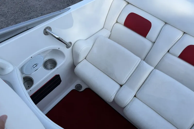 Slide: The Image of White and red boat interior with cup holders and cushioned seating, Profile 260 V, 2006 model. - 15