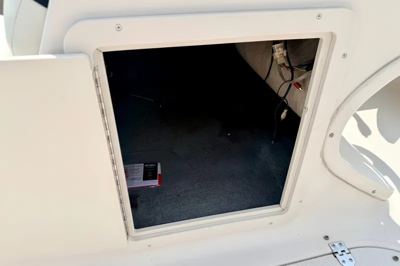 Slide: The Image of Open storage compartment in 2008 Starcraft 2000 IO Limited boat. - 55