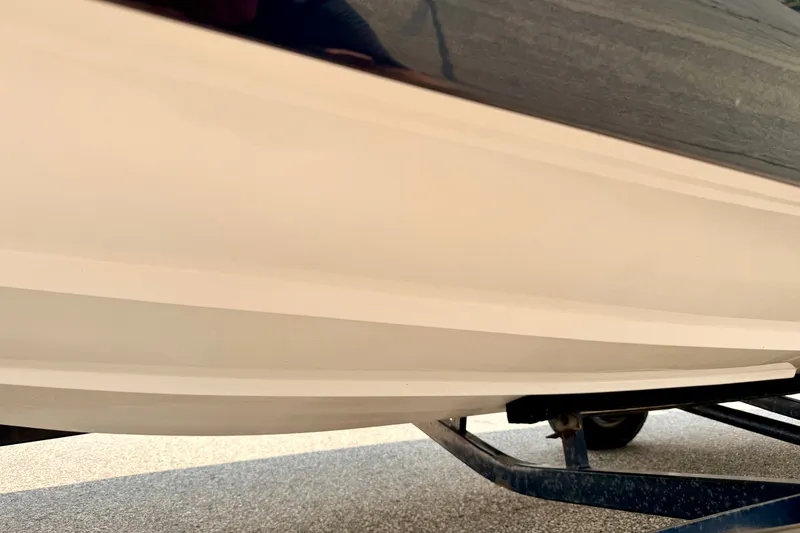Slide: The Image of 2008 Starcraft 2000 IO Limited boat hull on trailer, close-up view. - 72