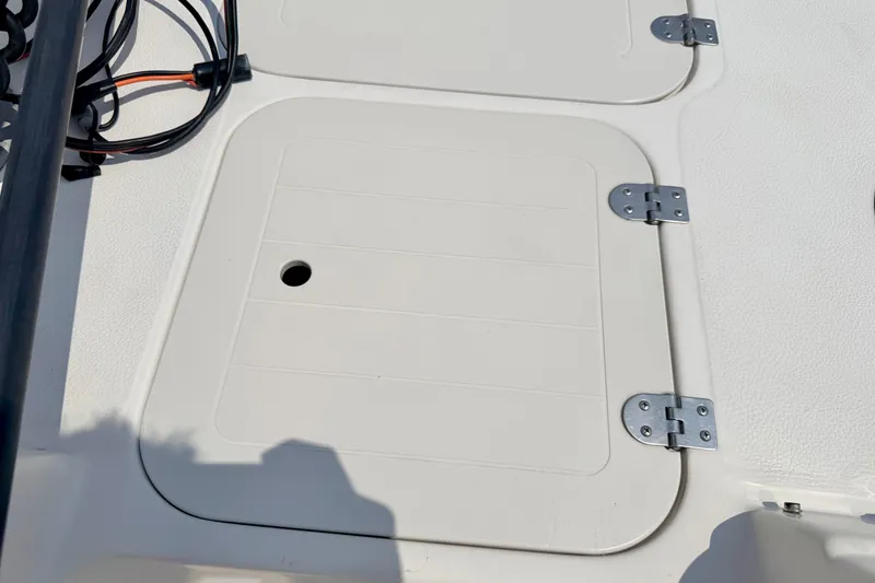 Slide: The Image of 2008 Starcraft 2000 IO Limited boat hatch with metal hinges and wiring. - 61