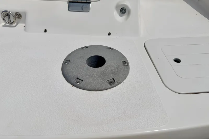 Slide: The Image of 2008 Starcraft 2000 IO Limited boat deck with circular mount and storage compartment. - 23