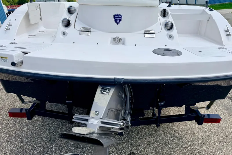 Slide: The Image of 2008 Starcraft 2000 IO Limited boat rear view with outboard motor. - 18