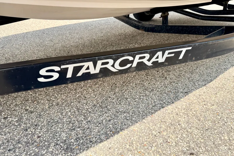 Slide: The Image of Close-up of 2008 Starcraft 2000 IO Limited boat trailer on pavement. - 74
