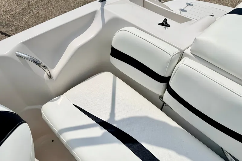 Slide: The Image of White seating on 2008 Starcraft 2000 IO Limited boat, featuring sleek design and black accents. - 32