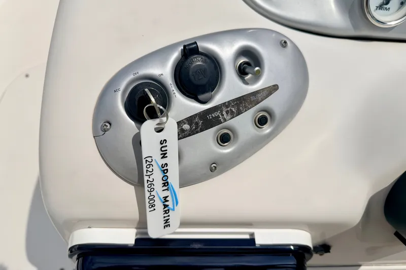 Slide: The Image of Control panel of a 2008 Starcraft 2000 IO Limited boat with ignition key. - 37