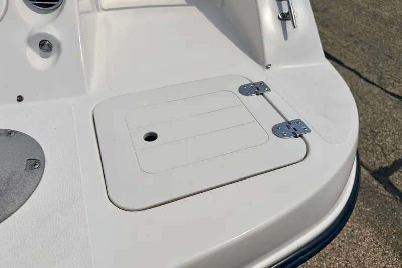 Slide: The Image of 2008 Starcraft 2000 IO Limited boat deck with hatch and hinges. - 21