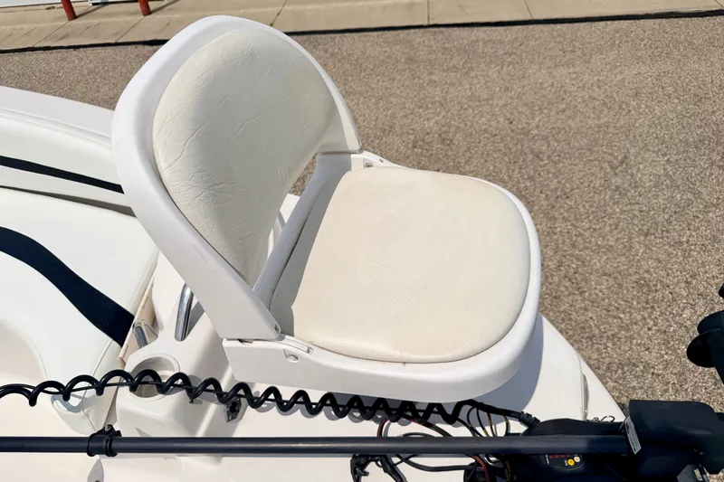 Slide: The Image of White seat on 2008 Starcraft 2000 IO Limited boat, outdoor setting. - 57