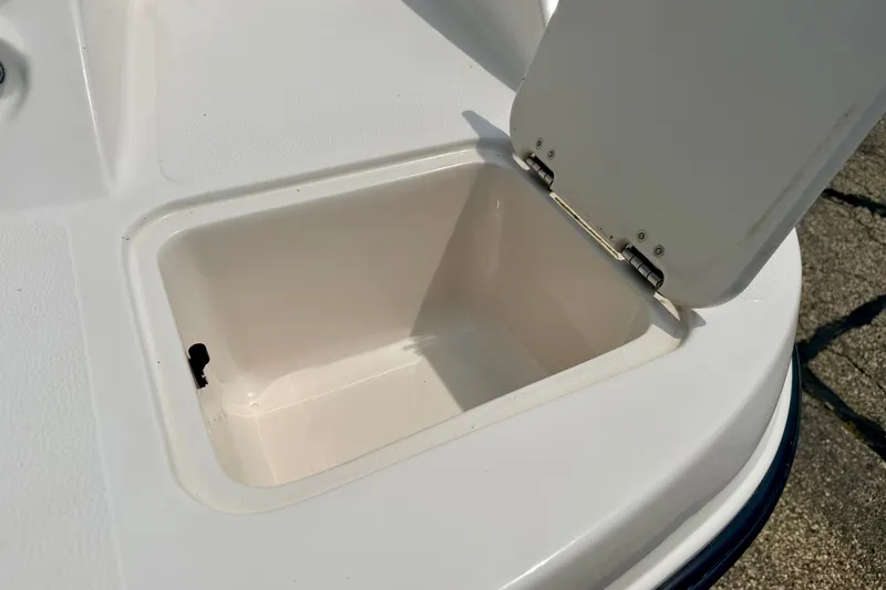 Slide: The Image of Open storage compartment on 2008 Starcraft 2000 IO Limited boat. - 22
