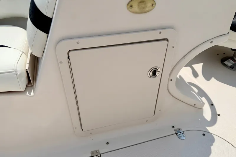 Slide: The Image of 2008 Starcraft 2000 IO Limited boat interior with storage compartment and seating. - 56