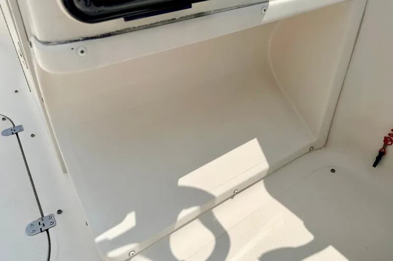 Slide: The Image of Interior compartment of a 2008 Starcraft 2000 IO Limited boat, featuring storage space. - 45