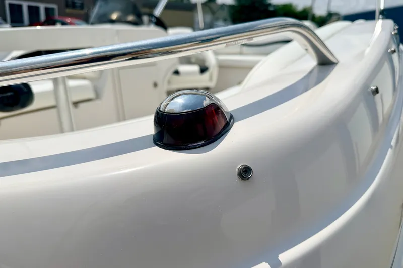 Slide: The Image of Close-up of a 2008 Starcraft 2000 IO Limited boat's railing and navigation light. - 71