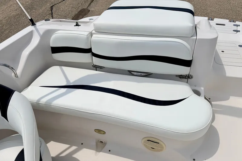 Slide: The Image of 2008 Starcraft 2000 IO Limited boat interior with white and black seating. - 29