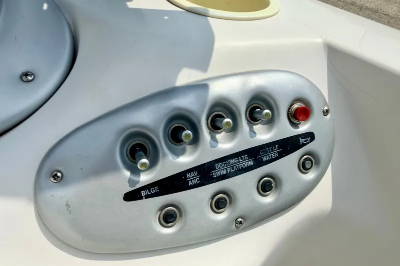 Slide: The Image of Control panel of a 2008 Starcraft 2000 IO Limited boat with labeled switches. - 43