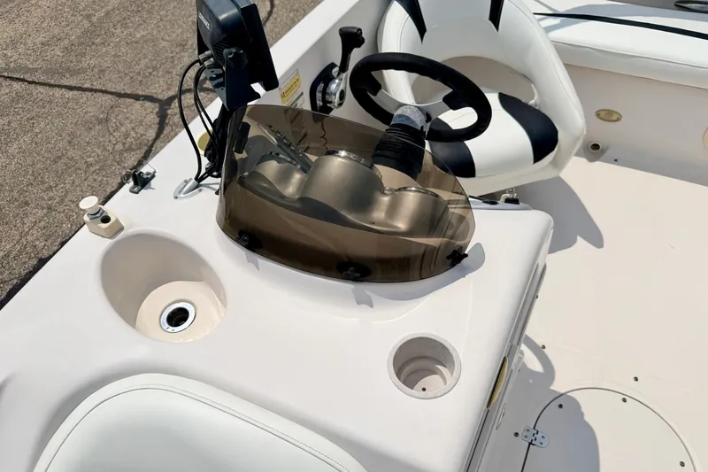 Slide: The Image of 2008 Starcraft 2000 IO Limited boat dashboard with steering wheel and seating. - 52