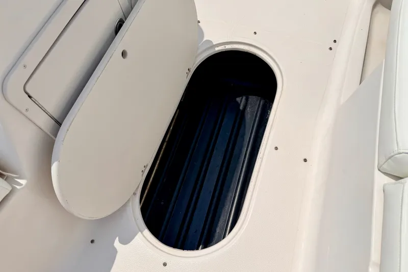Slide: The Image of Open storage compartment on a 2008 Starcraft 2000 IO Limited boat. - 54