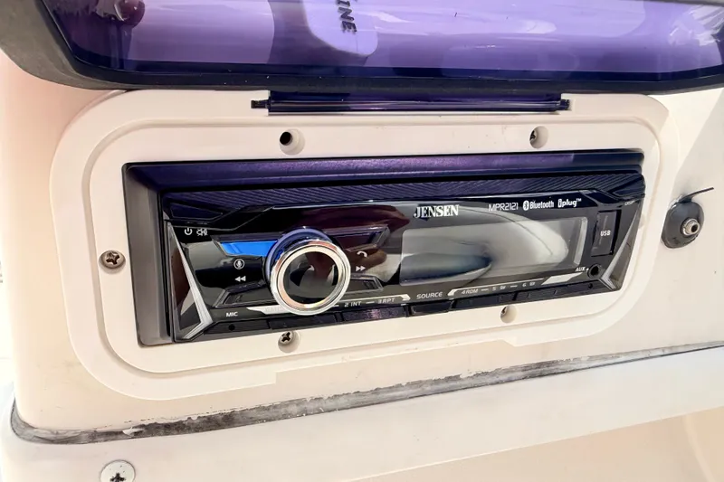Slide: The Image of Jensen stereo system in a 2008 Starcraft 2000 IO Limited boat dashboard. - 38