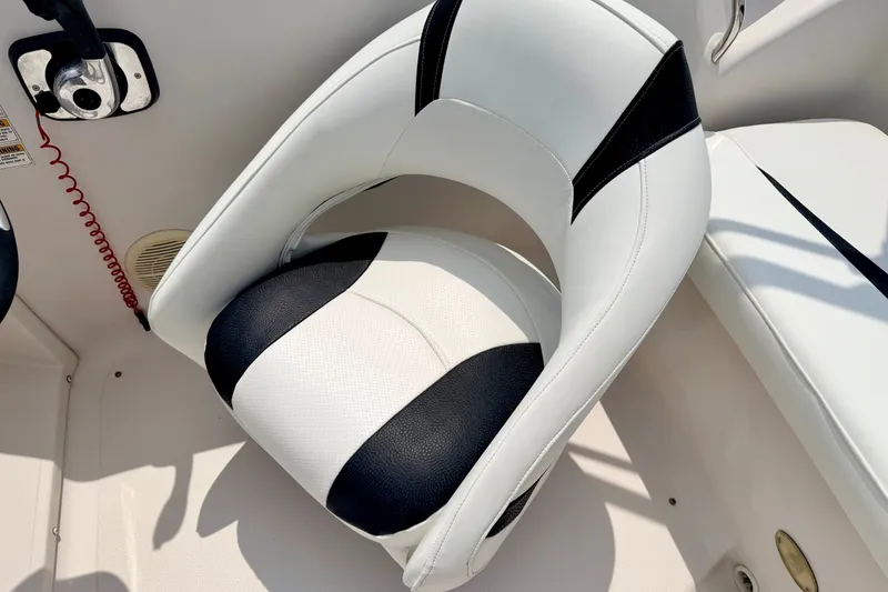 Slide: The Image of White and black boat seat in a 2008 Starcraft 2000 IO Limited. - 34