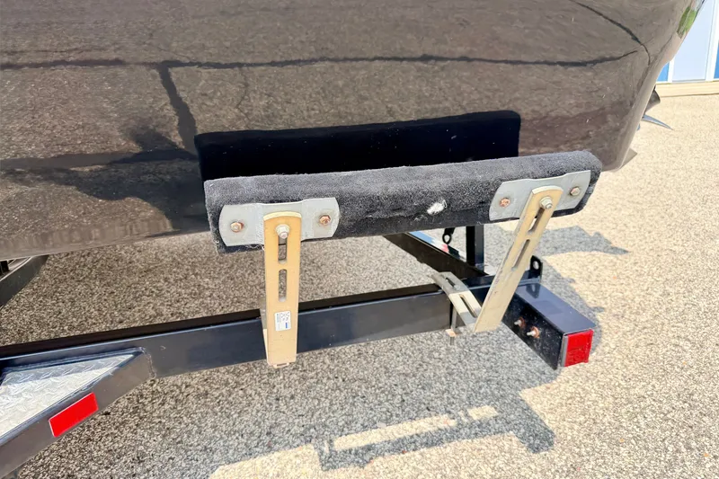 Slide: The Image of Rear view of a 2008 Starcraft 2000 IO Limited boat trailer on pavement. - 76