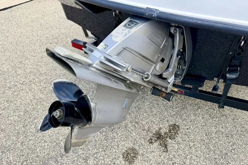 Slide: The Image of 2008 Starcraft 2000 IO Limited boat propeller and outdrive on pavement. - 16