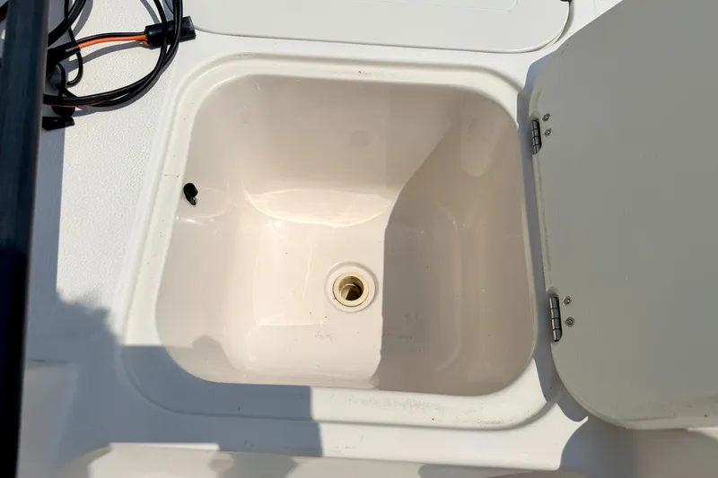 Slide: The Image of Open storage compartment on 2008 Starcraft 2000 IO Limited boat. - 62