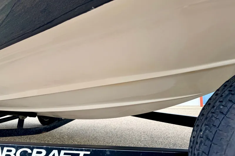 Slide: The Image of 2008 Starcraft 2000 IO Limited boat hull on trailer, close-up view. - 15