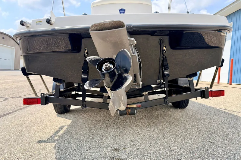 Slide: The Image of Rear view of a 2008 Starcraft 2000 IO Limited boat on a trailer. - 77