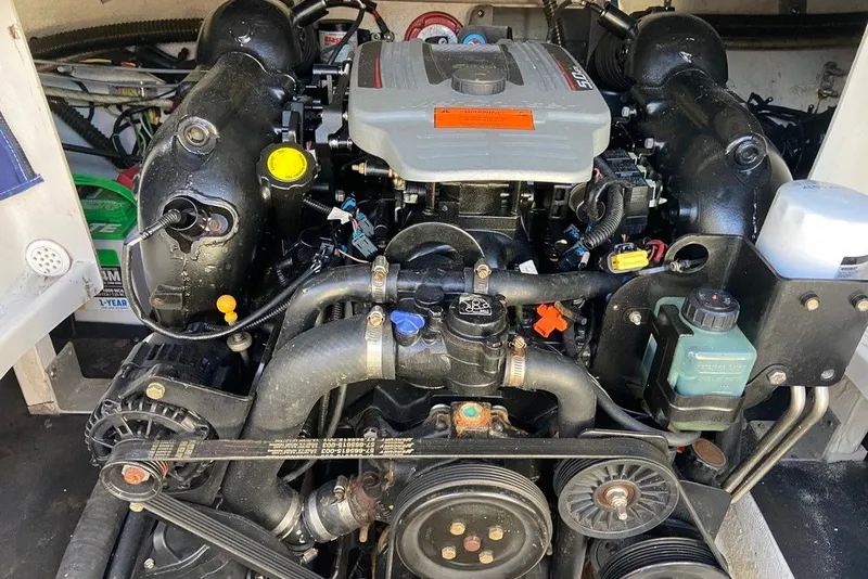 Slide: The Image of Engine compartment of a 2012 Crownline 236 SC boat, showcasing detailed components. - 28