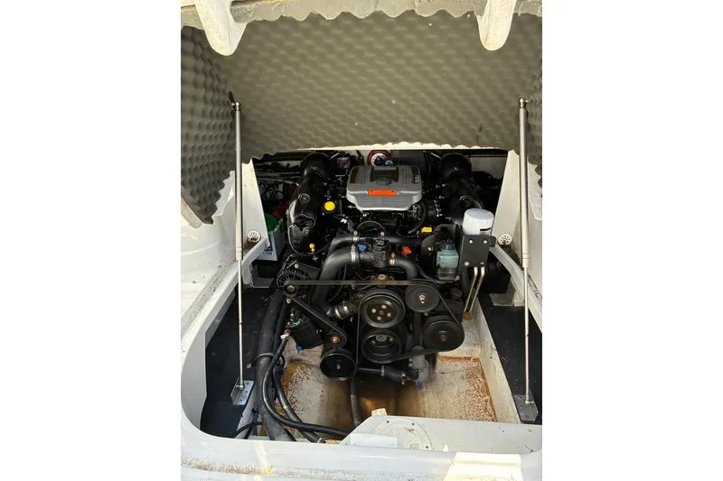 Slide: The Image of Engine compartment of a 2012 Crownline 236 SC boat, showcasing detailed mechanical components. - 38