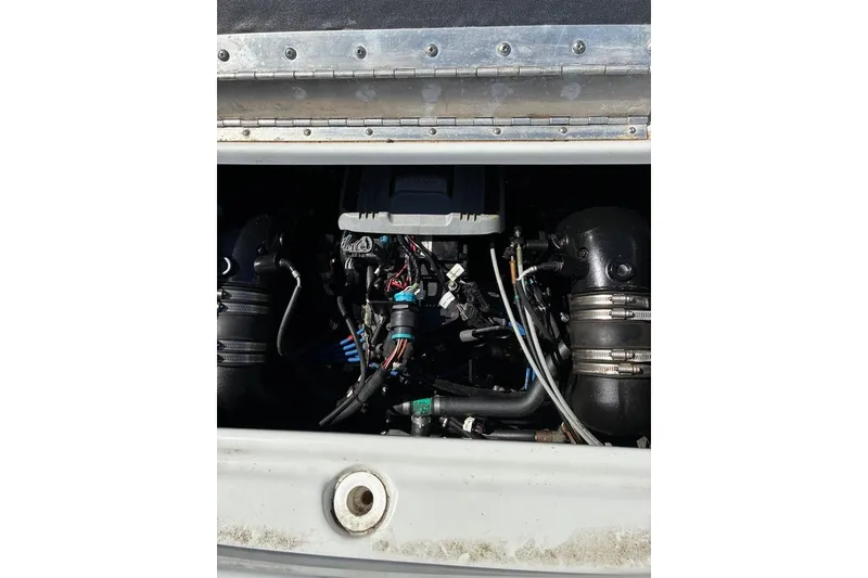 Slide: The Image of Engine compartment of a 2012 Crownline 236 SC boat, showing detailed components. - 39