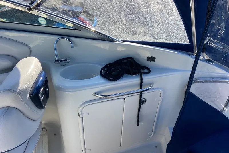 Slide: The Image of Interior of 2012 Crownline 236 SC boat with sink and storage area. - 17