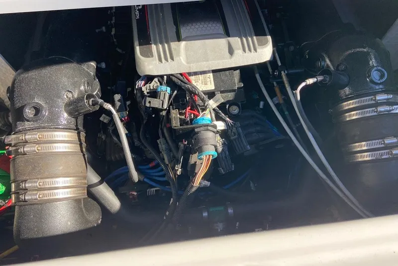 Slide: The Image of Engine compartment of a 2012 Crownline 236 SC boat, showing wiring and components. - 31