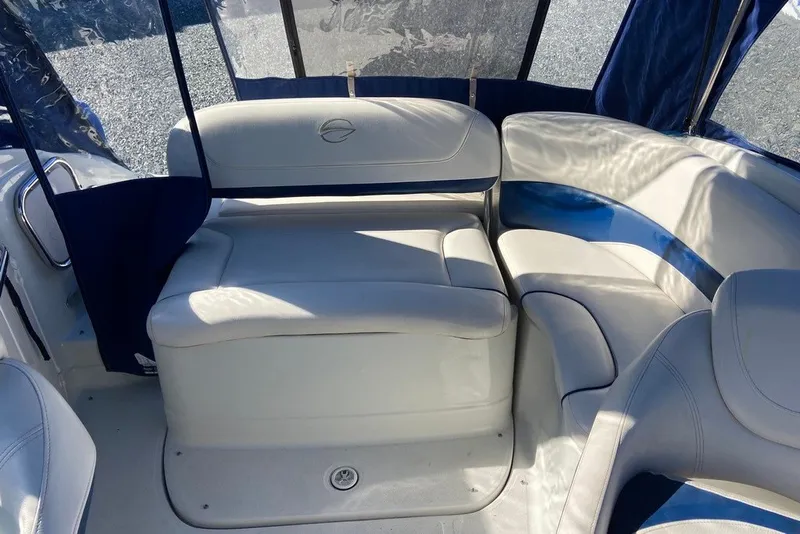 Slide: The Image of Interior seating of a 2012 Crownline 236 SC boat with white upholstery. - 16