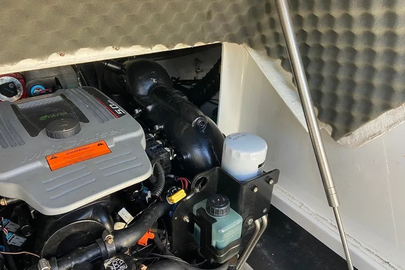 Slide: The Image of Engine compartment of a 2012 Crownline 236 SC boat, featuring a MerCruiser engine. - 30