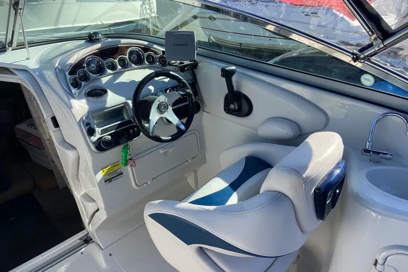Slide: The Image of Interior cockpit of 2012 Crownline 236 SC boat with steering wheel and Garmin GPS. - 18