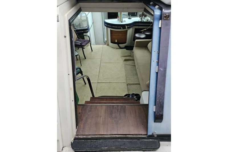Slide: The Image of Interior view of 1988 Wellcraft San Remo boat, featuring seating and helm area. - 18