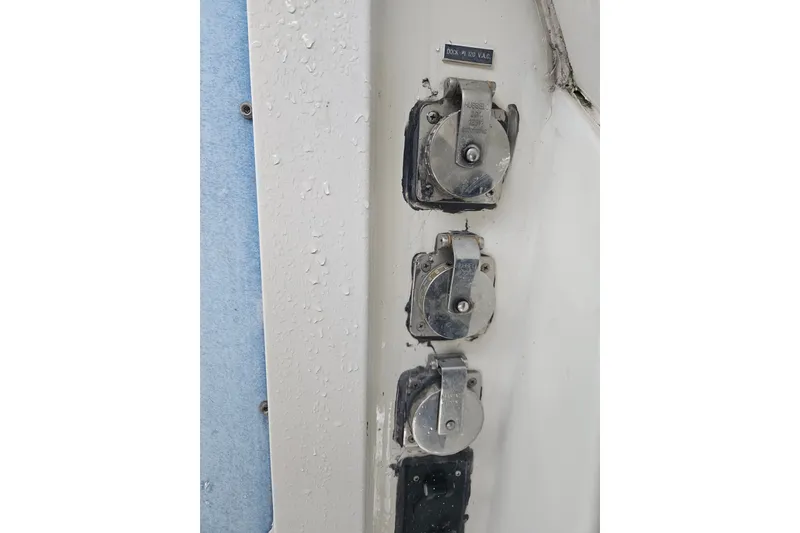 Slide: The Image of Electrical outlets on a 1988 Wellcraft San Remo boat, featuring Hubbell covers. - 33