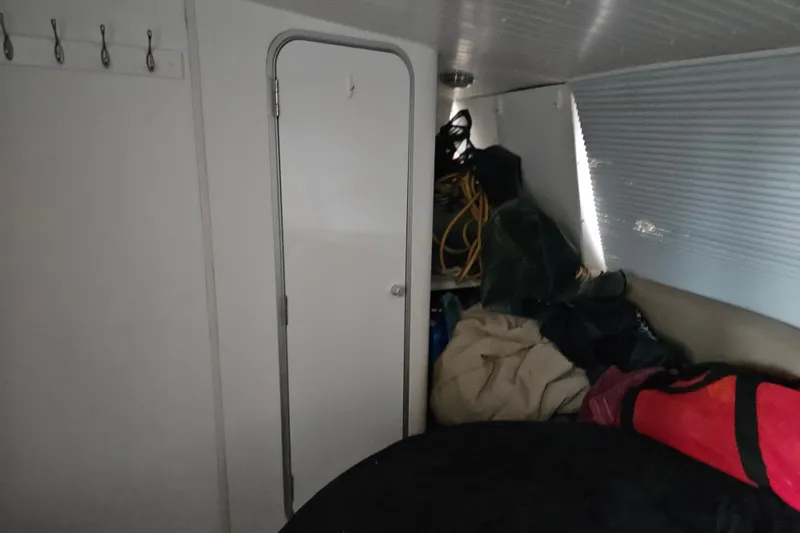 Slide: The Image of Interior of 1988 Wellcraft San Remo boat with storage and door. - 32
