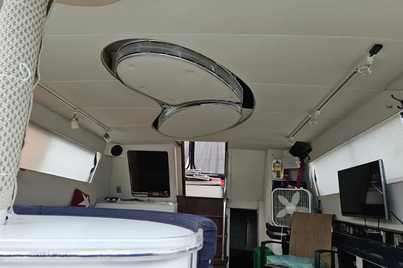 Slide: The Image of Interior of a 1988 Wellcraft San Remo boat, featuring modern amenities and seating. - 26