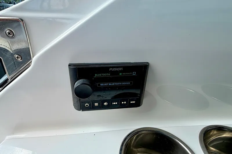 Slide: The Image of Fusion Bluetooth audio control panel on 2023 Cobalt R6 Surf boat dashboard. - 41