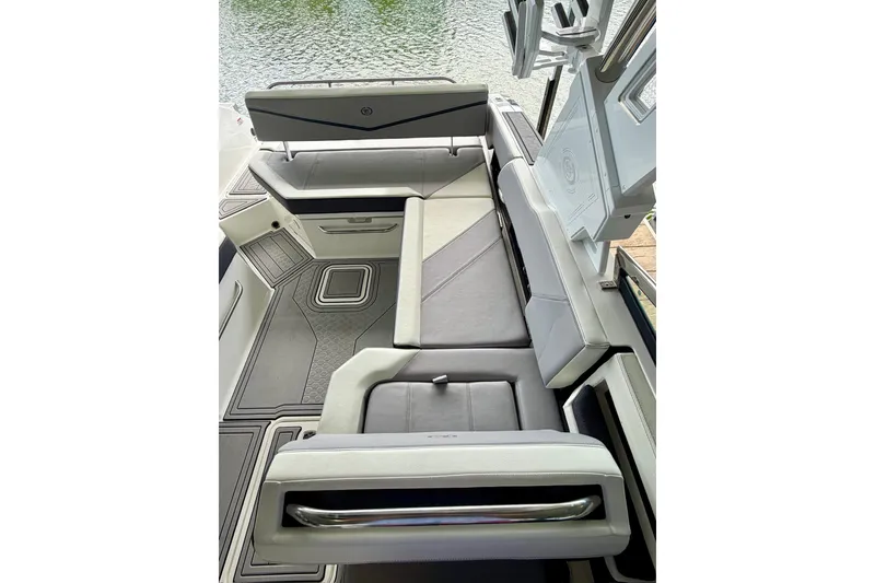 Slide: The Image of 2023 Cobalt R6 Surf boat interior with sleek seating and modern design. - 46