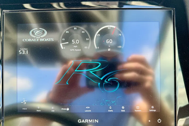 Slide: The Image of Dashboard display of 2023 Cobalt R6 Surf boat showing GPS speed and engine hours. - 22