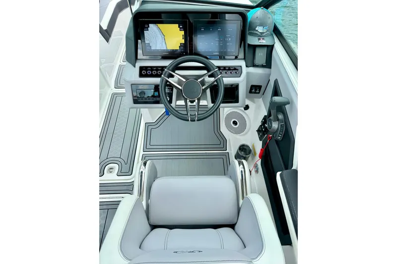 Slide: The Image of 2023 Cobalt R6 Surf boat cockpit with modern steering and navigation system. - 18
