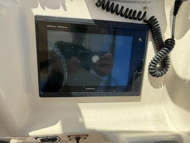 Slide: The Image of A Garmin GPSmap 7410xsv is mounted on a boat's dashboard. - 15