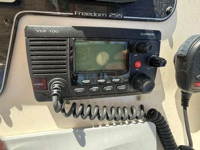 Slide: The Image of A Garmin VHF 100 radio is mounted on a Grady-White Freedom 255 boat. - 16